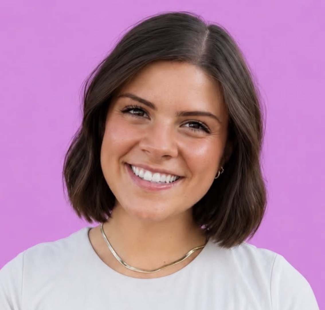 Becca Gurr smiling against a pink background